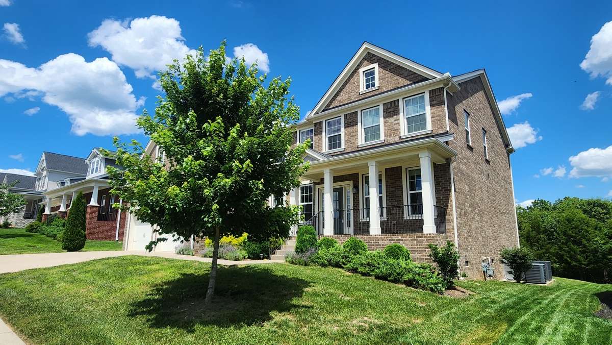 Nice trees, shrubs, and flower landscaping.