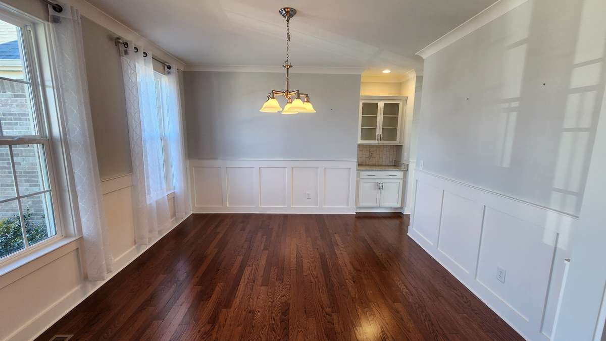 Large dining room having plenty of room for family and friends to enjoy your new home celebration and all the many memories to be made!