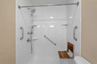 Walkin shower w/ bench and many shower heads, big too..