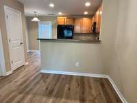 View from dining table of kitchen and courtyard entrance