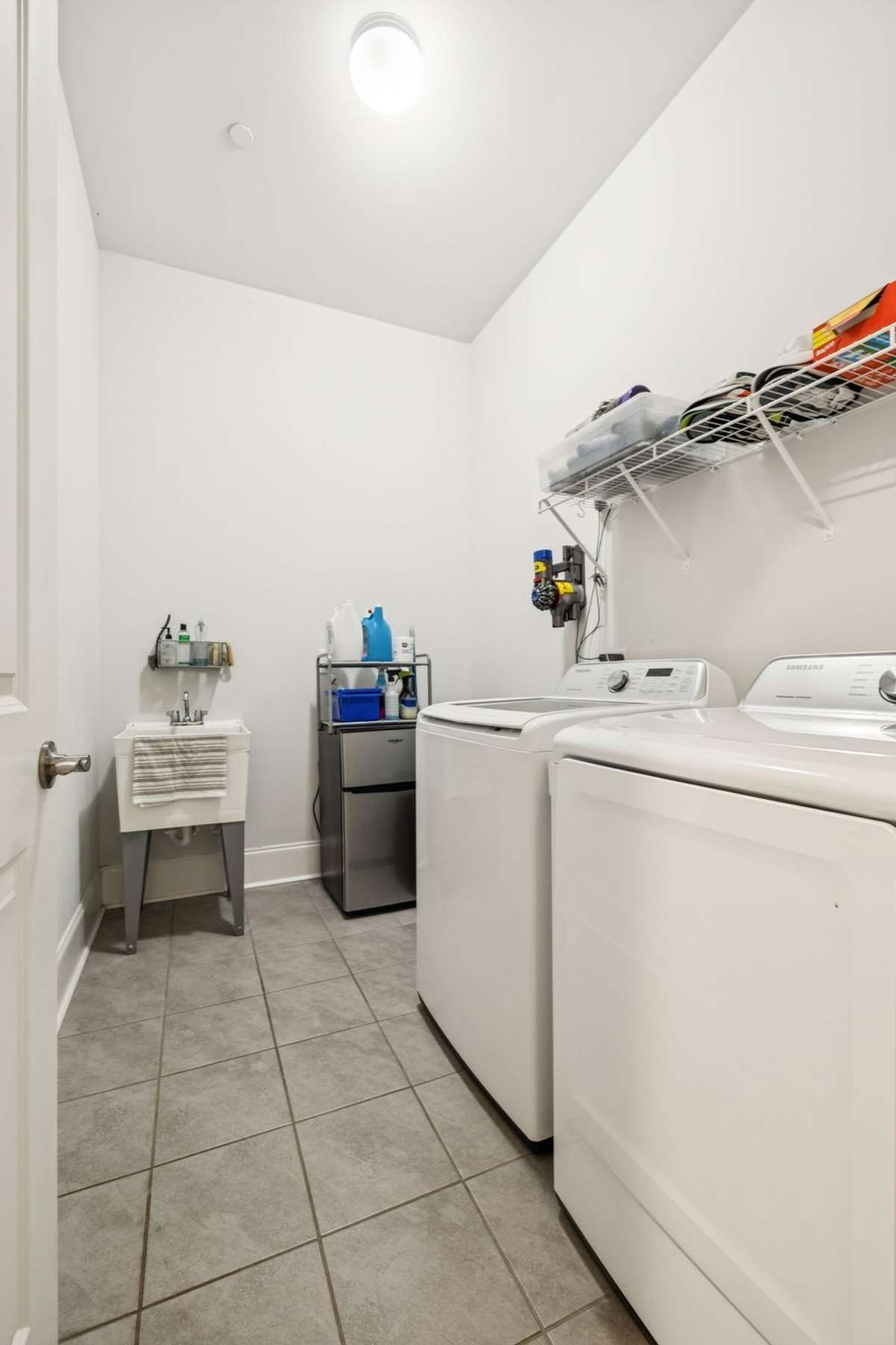 Laundry room with plenty of space to asdd custom cabinets for additional storage.