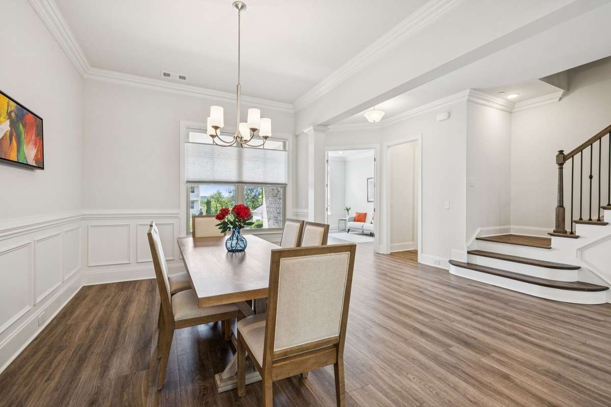 Formal dining area with wainscotting.