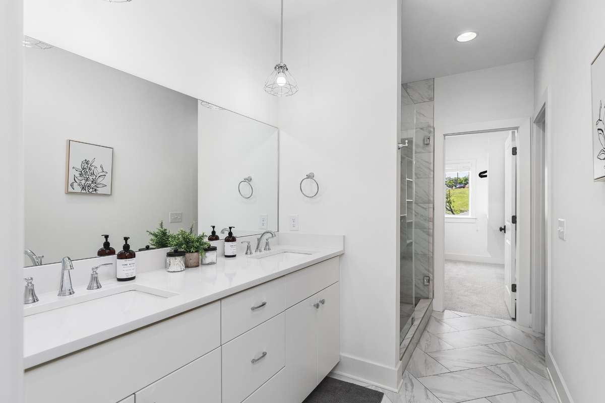 Primary bathroom en suite on 4th floor with water closet, and walk-in large bedroom closet