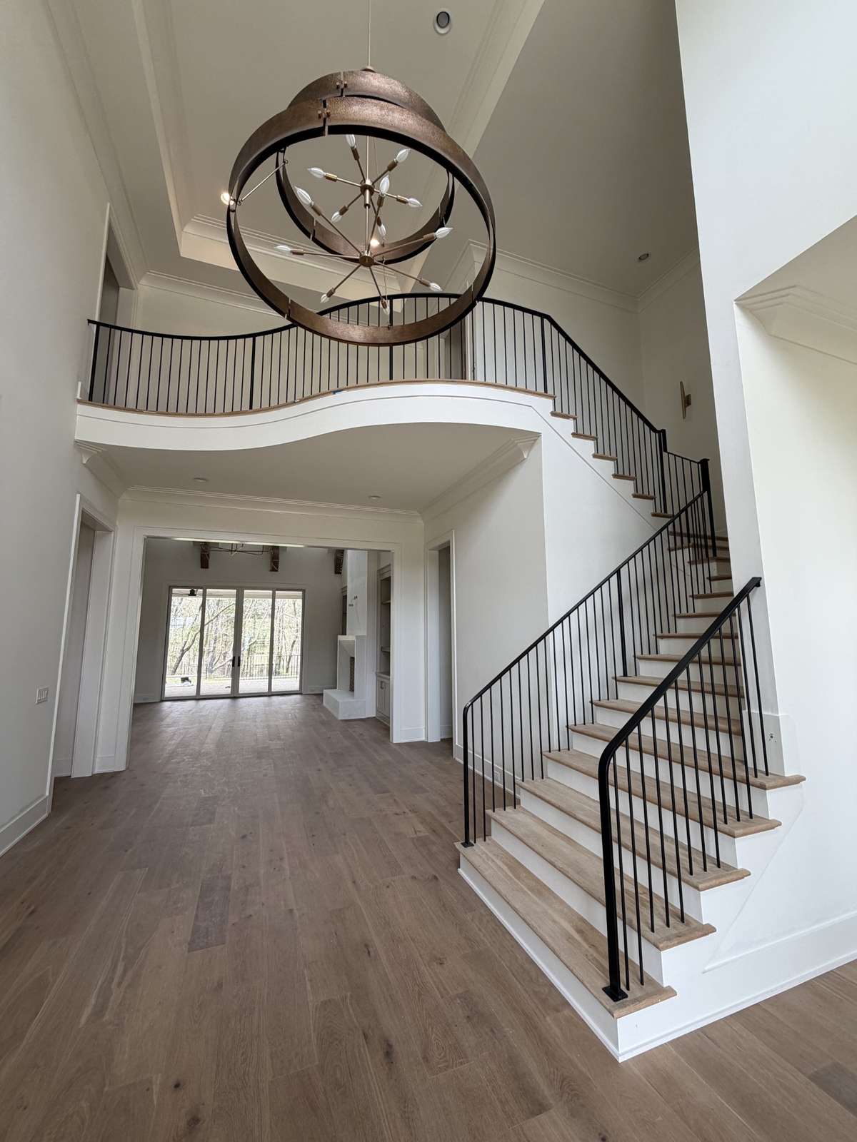 Beautiful two-story foyer with lots of natural light.*this home is under construction.  Photo taken: 4/3/26