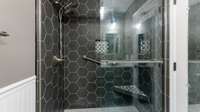 Large tile shower in hall Bath