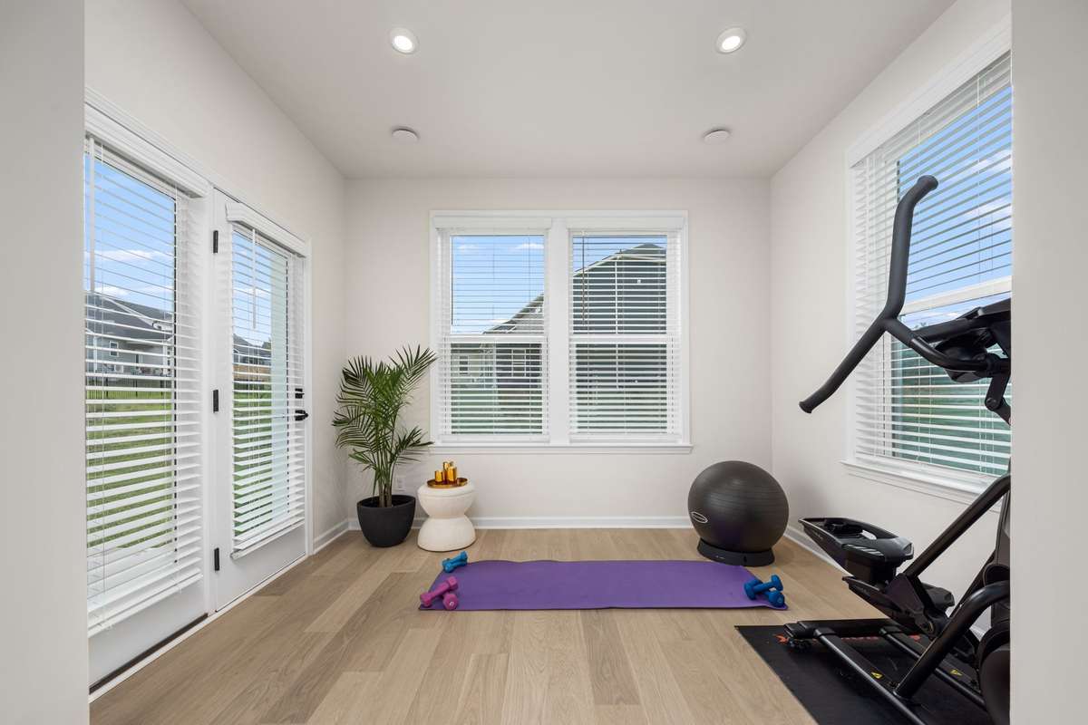 This sunroom is yet another flex area on the main level. Ideas include workout area, pocket office, playroom that flows to backyard, hobby room, reading nook and more!