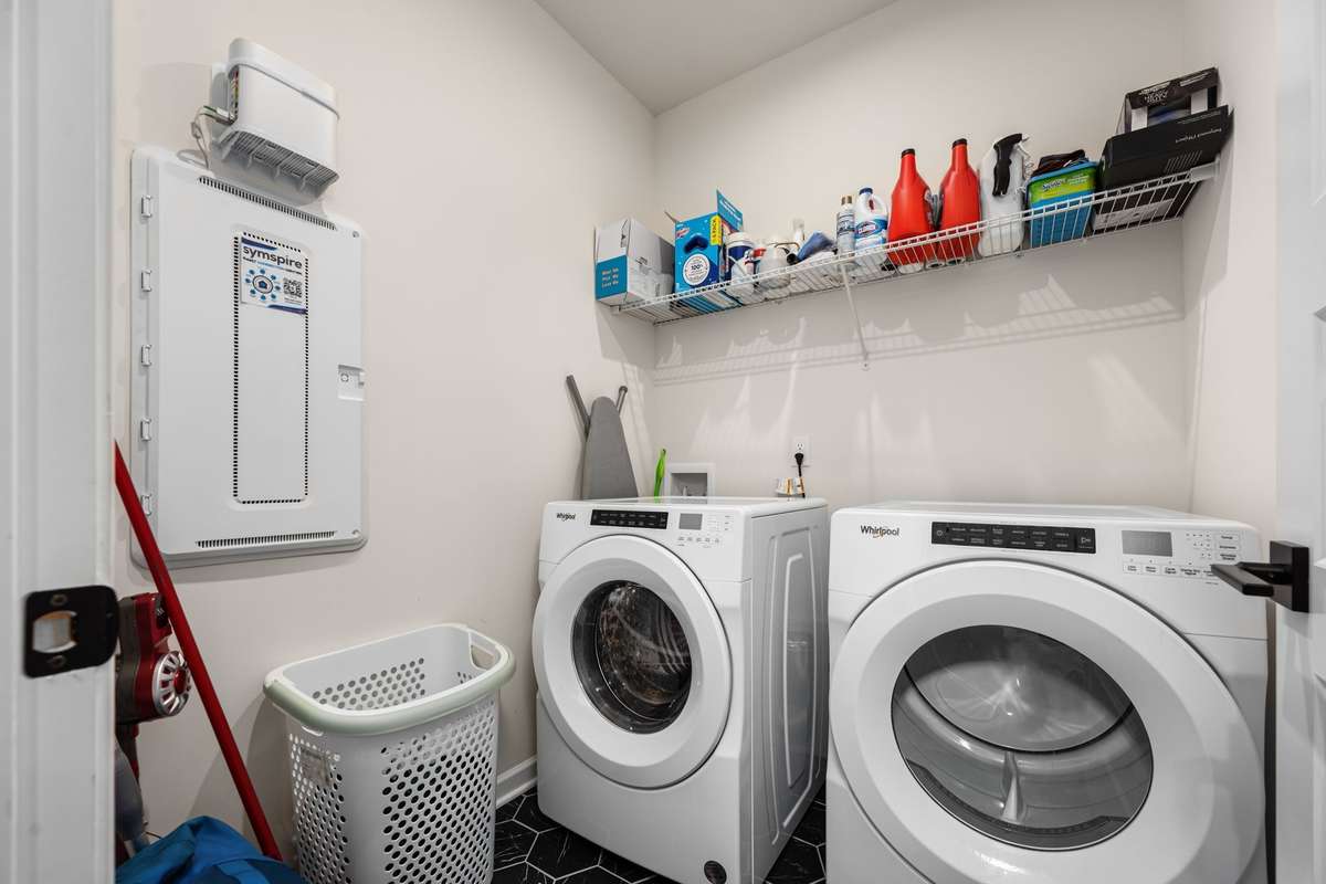 Walk-in laundry room off of the garage with plenty of space