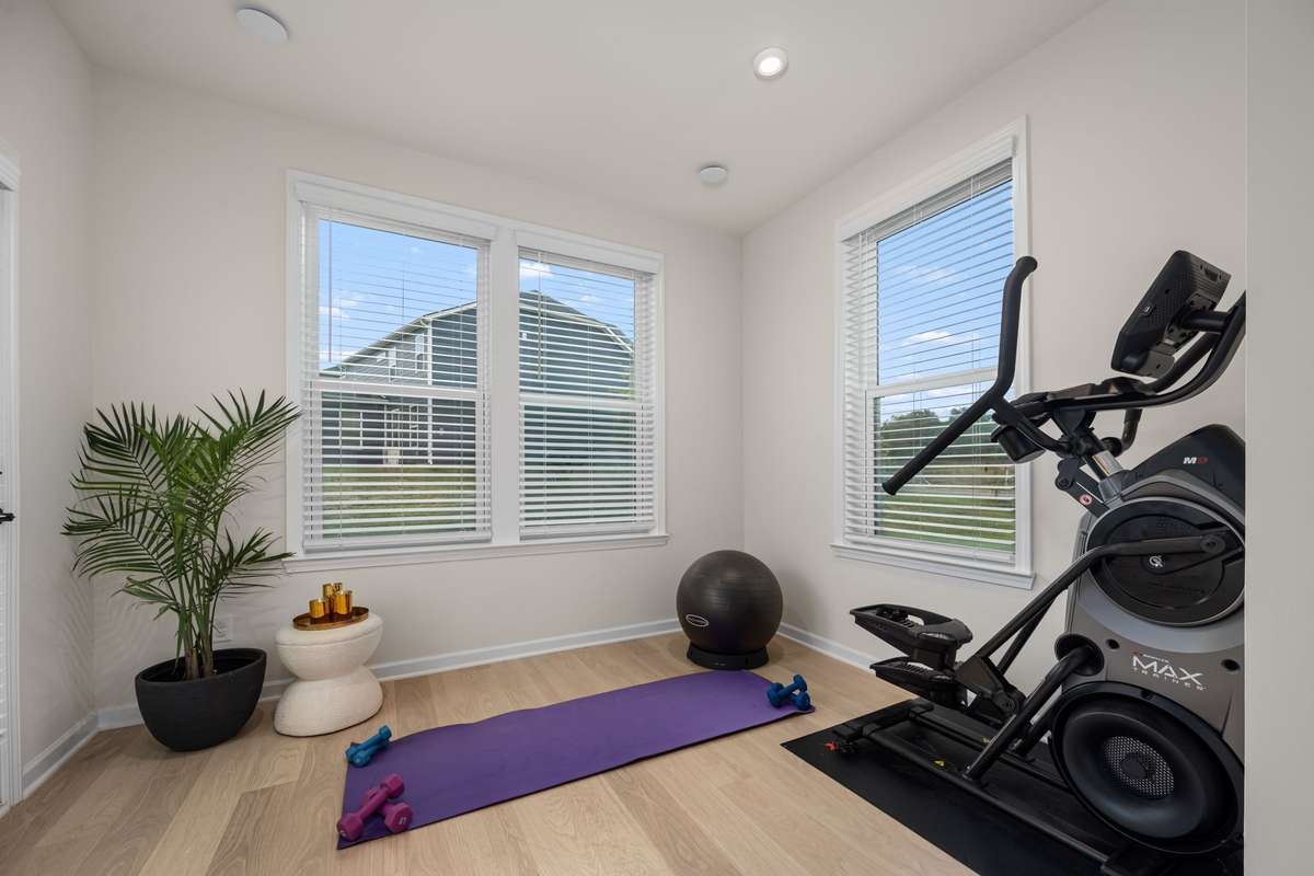 This sunroom is yet another flex area on the main level. Ideas include workout area, pocket office, playroom that flows to backyard, hobby room, reading nook and more!
