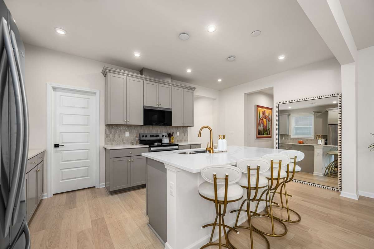 Walk-in pantry for all your groceries. Spacious island seats up to 4 comfortably.