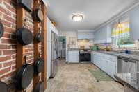 Kitchen with an accent true brick wall