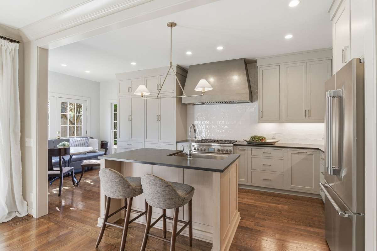 CUSTOM KITCHEN CABINETRY ALONG WITH CUSTOM VENT HOOD