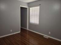 Hardwood flooring in the primary bedroom