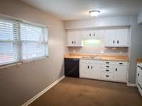 Under the carpet is tile flooring.