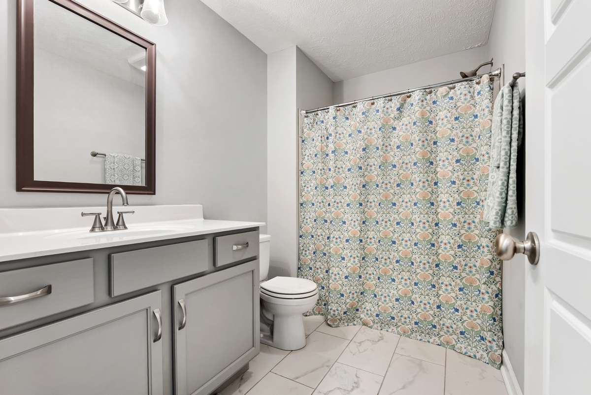 Full bathroom with a single vanity sink and shower/ tub combo.  561 Tacoma Dr Clarksville TN 37043