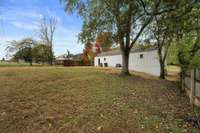 The large back yard awaits your garden, just bring your green thumb!