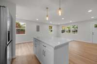 A look toward the living and dining areas from the kitchen.