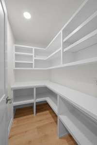 The walk in pantry is huge, and provides storage for food products, appliances, cookware, dishes, and serve ware.  This is the hardest working room in the house!