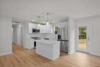 This kitchen checks all of the boxes..high end appliances, a workspace island, and there's a walk in pantry.