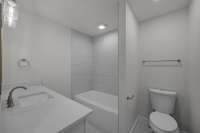 The hall bath serves the two additional bedrooms.