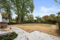 There is a patio area for grilling and gathering.