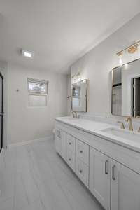 The primary bathroom features double vanities.