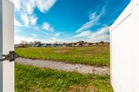 Gates on the side and back provide convenient access and flexibility for landscaping or additional features.