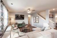 The living room offers a spacious and comfortable gathering area with plenty of room for seating and everyday living.