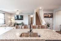 A close-up of the kitchen island highlighting the generous counter space, perfect for meal prep, serving, or additional bar-style seating for casual dining.