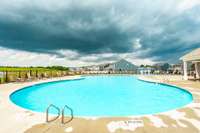 The pool area provides ample space for lounging, swimming, and entertaining friends and family.