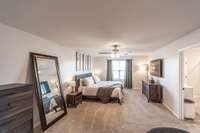 The primary suite is generously sized, providing a comfortable and private retreat for homeowners.