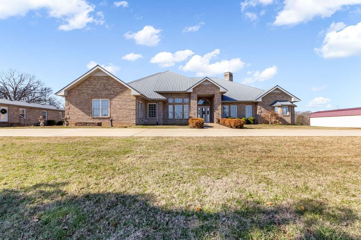 Stunning One-Level Private Estate situated on 10.91 rolling acres. Main home consists of 4200+ square feet, guest home offers 1400 square feet... Multi-generational compound!