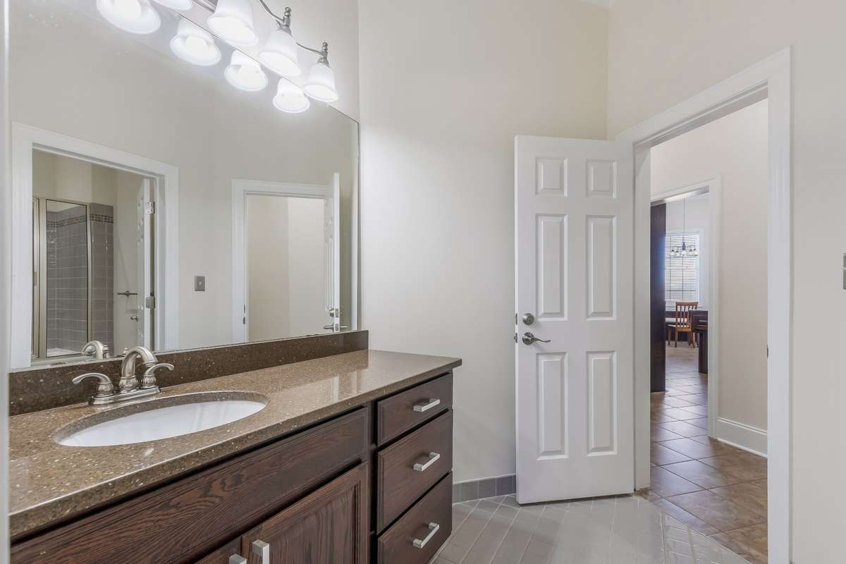 This bathroom can be accessed from the hallway across from the kitchen and keeping room.