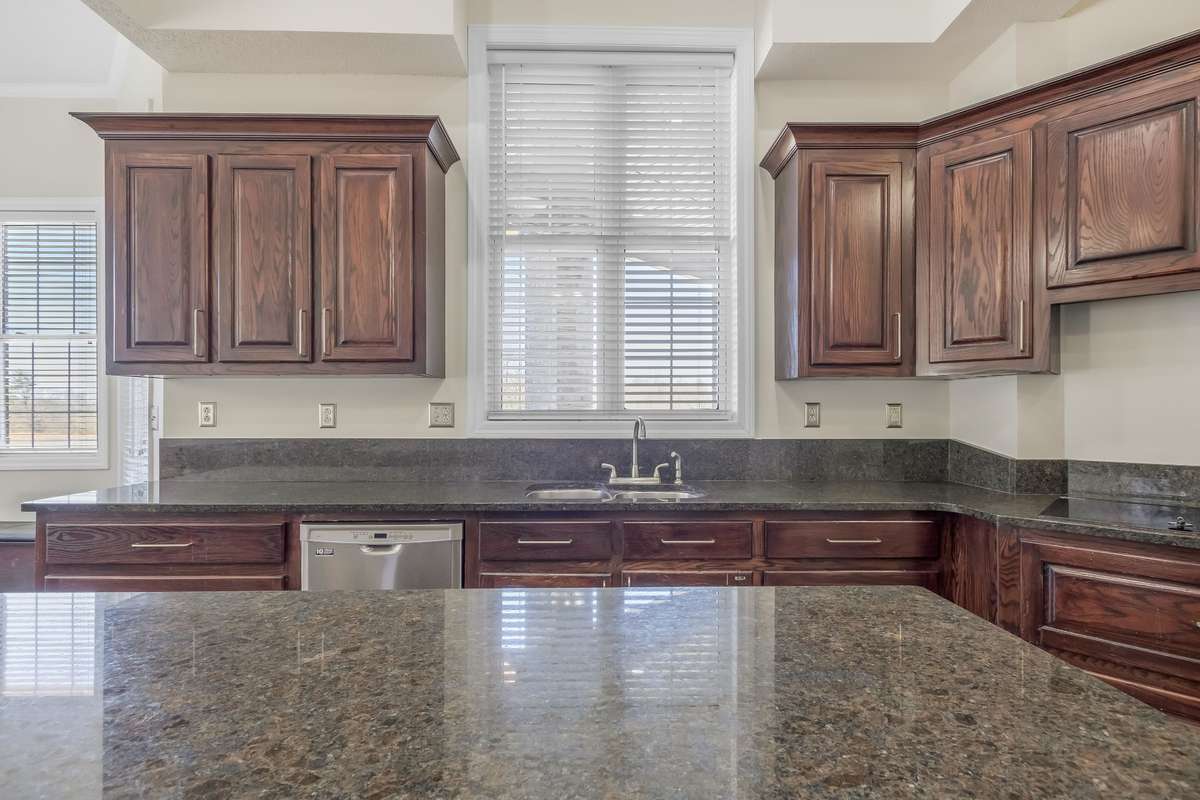 From the stone countertops to the plethora of outlets to the abundance of prep space and storage options... yes this kitchen is exactly what you need!