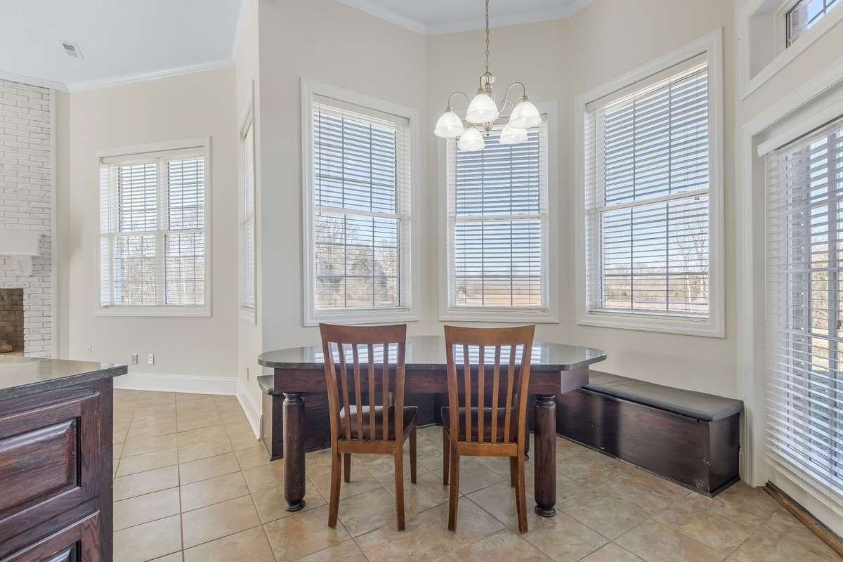 Breakfast table and wrap around fixed bench surrounded by windows allow for the most breathtaking view of your pastureland...