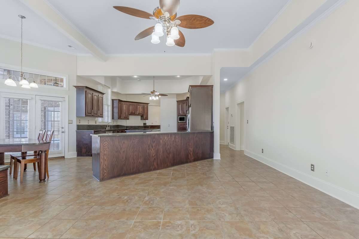 View from the keeping room looking back into the kitchen.. This home was created to entertain!