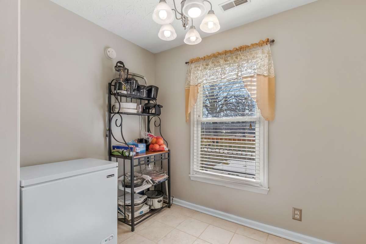 This space could make an adorable breakfast table nook... or a home office adjacent the kitchen.