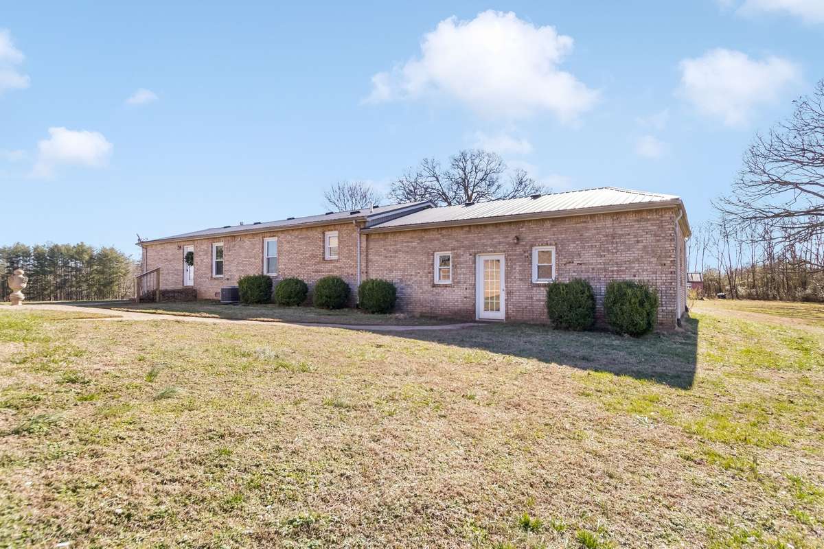 The guest home has a hybrid HVAC unit (dual heat) and is less than 2 years old. There is a stone paver courtyard that connects both homes.