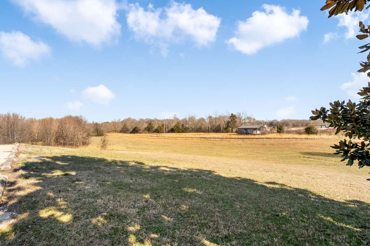Welcome to your Tennessee Sanctuary - Where the Hills Roll, the Sunsets Settle and Life Slows Down. Stunning One-Level Private Estate situated on 10.91 rolling acres in beautiful Rock Island.