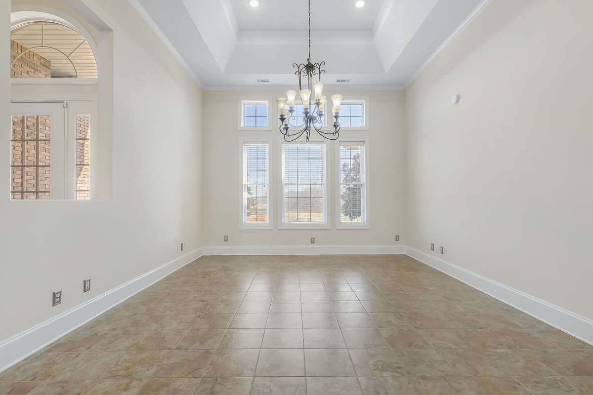 Sunken trey ceiling, nearly floor to ceiling windows.. this space is large enough for all of your guests!