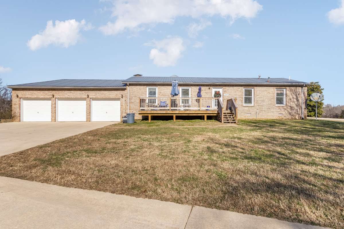 We should take a look at the guest home... This home offers a newly erected wooden deck and plenty of parking...