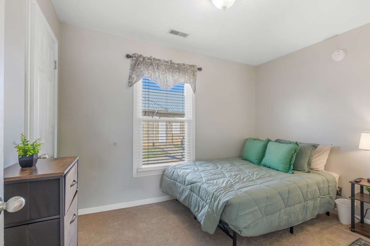 Here is the first of three bedrooms with a view of the main house.