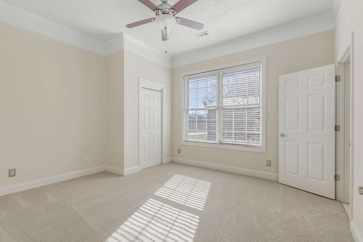 This bedroom has a view of the mother in law quarters just through the courtyard..
