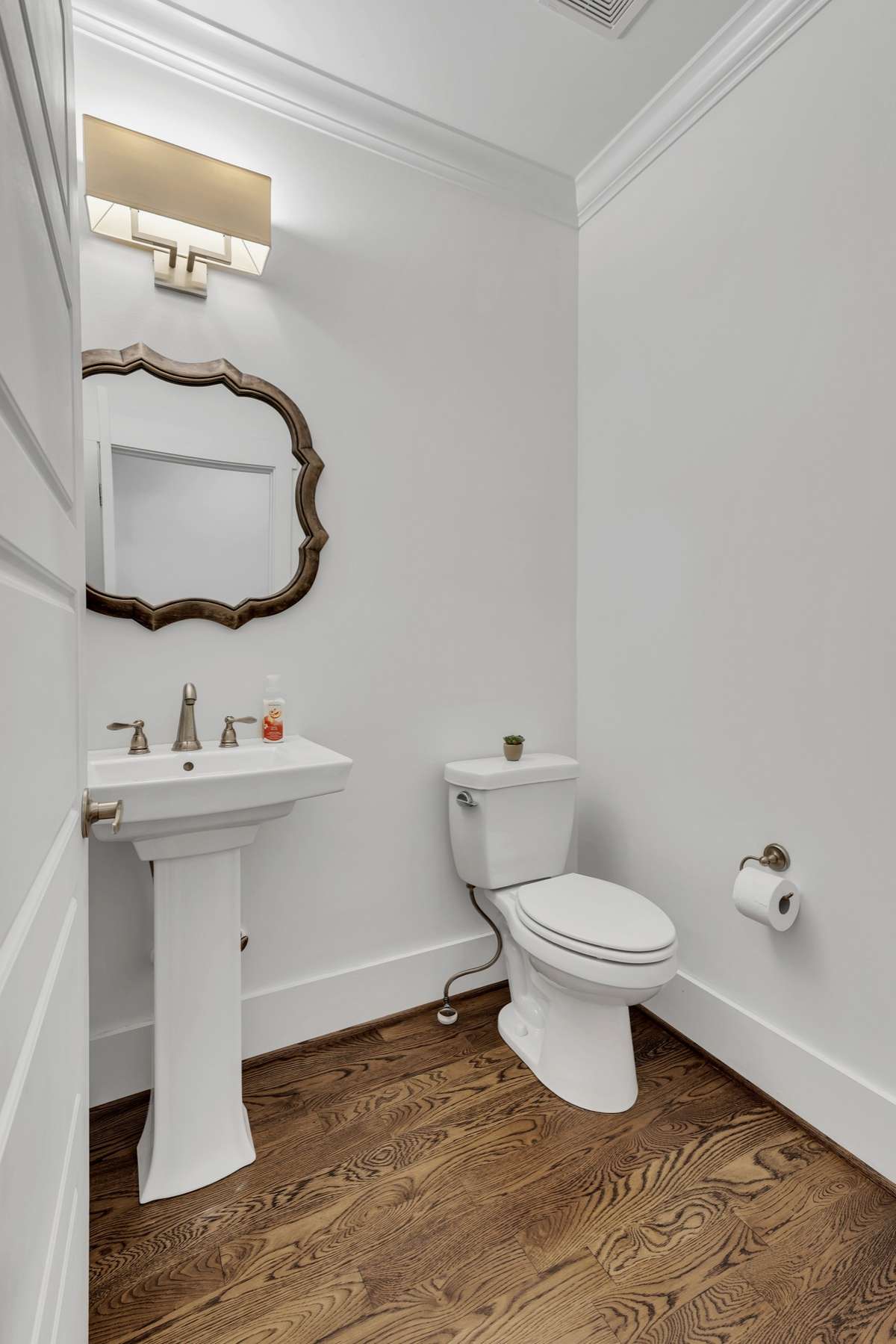 This 1/2 bath is located on the main level, just outside of the flex room.