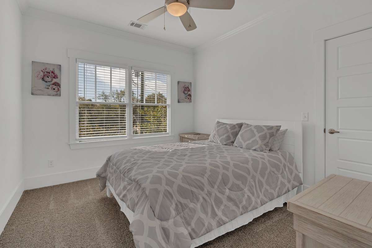 Upstairs Bedroom offers natural light and a walk in closet.