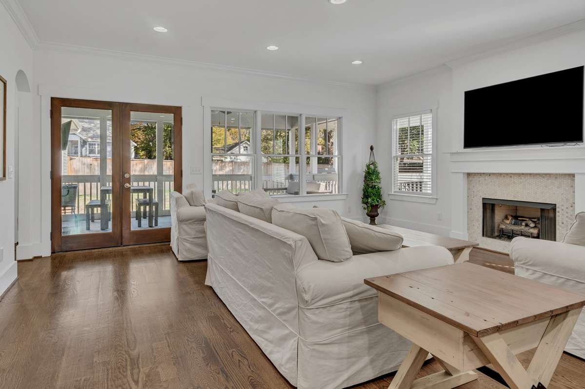 This Living Room with gas fireplace is a wonderful entertaining spot, or great to watch football, basketball or your favorite Netflix movie. Double doors lead out to your screened porch, overlooking the back yard.
