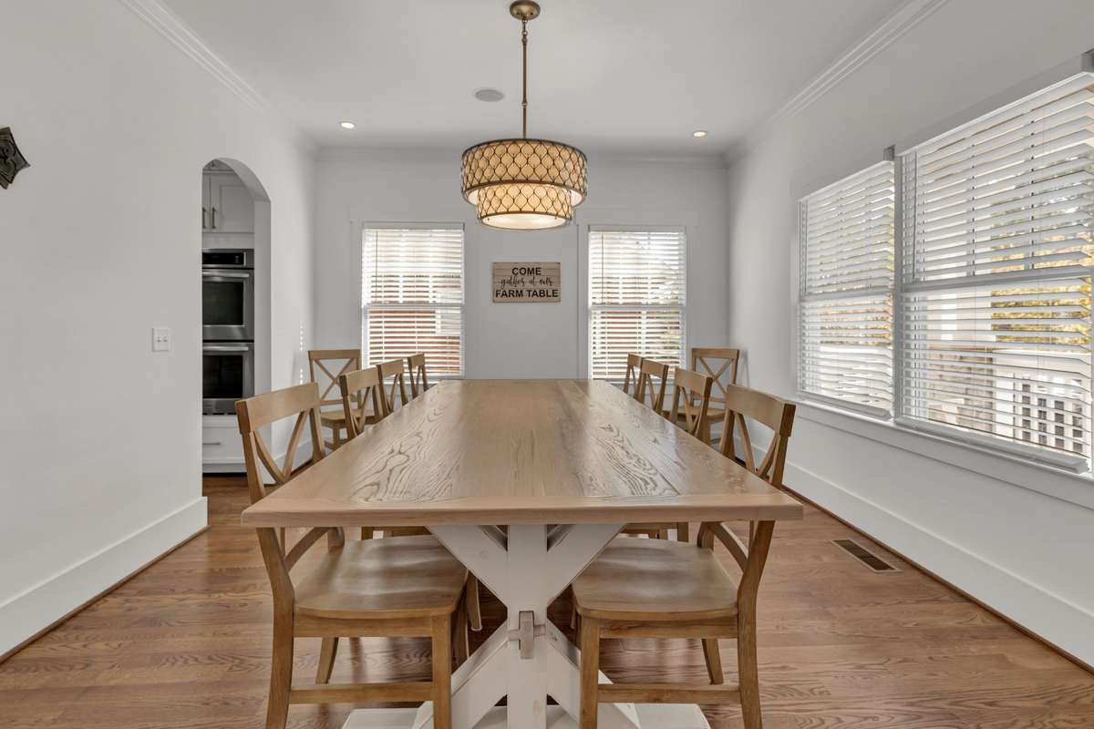 This Dining Room is spacious enough to fit a farmhouse table that seats 10, arched doorway leads to the Kitchen for easy access.