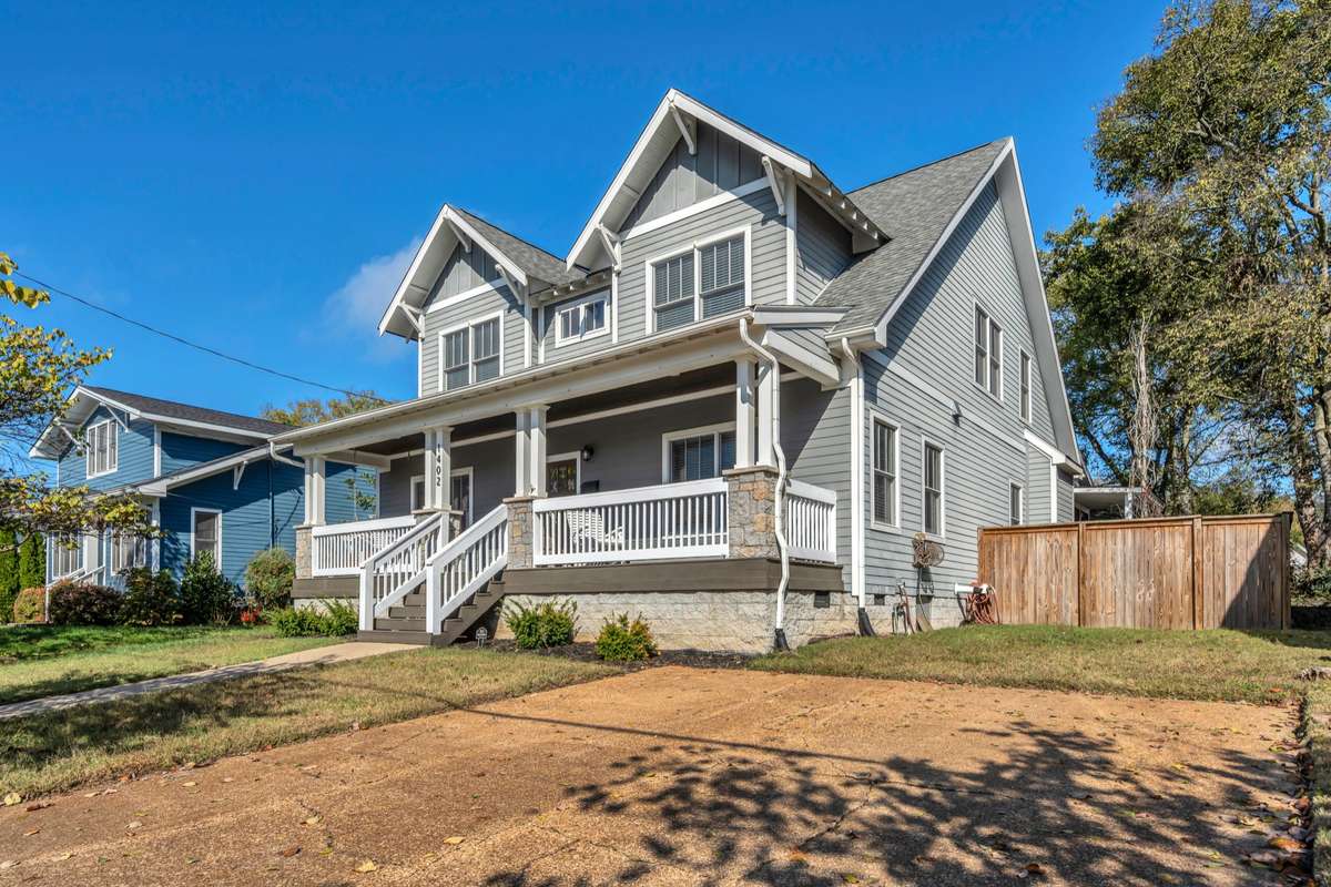 This 2-car parking pad is great for guests or extra vehicles; invaluable in 12 South! PLUS you've also got a 2 - car garage with alley access in the back!