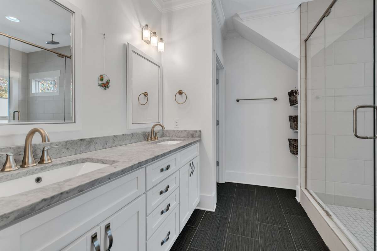 Primary Ensuite Bath with double sinks + heated tile floors- AHHHH! Freshly painted cabinets, new hardware.