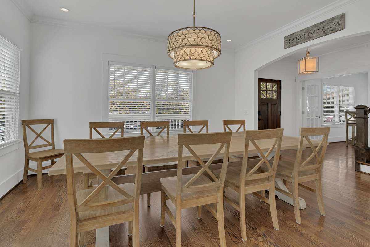 Nice windows to let in plenty of natural light and a gorgeous chandelier to finish off the space.