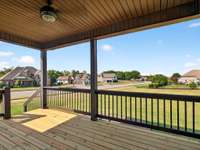 Newly refinished back deck with fan